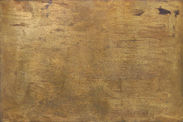 rusty golden metal surface with yellow and orange tones - worn steampunk background with screws and...