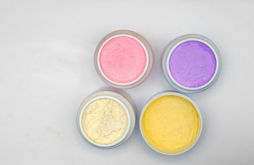 Obraz na płótnie Canvas Dry colored powders for preparation of alginate masks