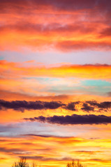 Obraz premium Panorama of colorful x clouds in the sunset sky