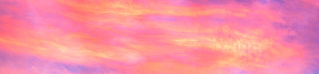 Panorama of colorful x clouds in the sunset sky