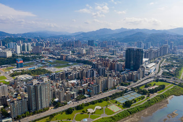 Naklejka na ściany i meble Aerial sunny view of the Xindian District cityscape