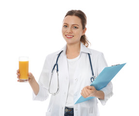 Nutritionist with glass of juice and clipboard on white background