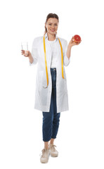 Nutritionist with glass of water and grapefruit on white background