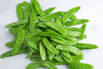 Sugar Snap Peas on  a Light Surface