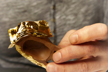 Artwork of gilding - covering an object with plate metal gold