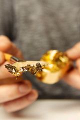 Artwork of gilding - covering an object with plate metal gold