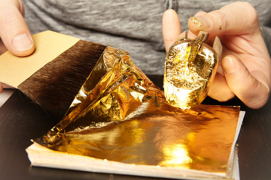 Artwork of gilding - covering an object with plate metal gold
