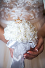 Two wedding gold rings at a wedding. Wedding rings are a symbol of love and fidelity.