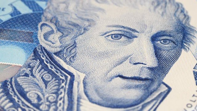 Alessandro Volta portrait on Italy 10000 lira (1984) banknote rotating. Famous Italian physicist, inventor of the electric battery. Low angle, macro. 4K, 422 10 bit