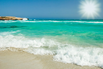 beautiful beach with waves in the nature of the background