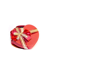 red gift box with a bow on a white background isolated