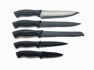 Composition of black knives isolated on white background. Composition of the chef knife, bread...