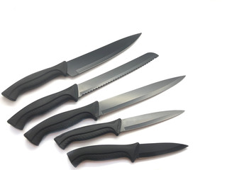 Composition of black knives isolated on white background. Composition of the chef knife, bread...