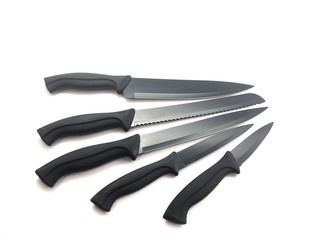 Composition of black knives isolated on white background. Composition of the chef knife, bread...