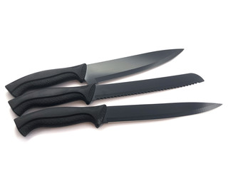 Composition of black knives isolated on white background. Composition of the chef knife, bread...