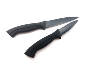 Knife composition isolated on a white background. Set of black matte knives. Paring knife and utility knife. Sharp blade.