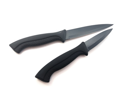 Knife composition isolated on a white background. Set of black matte knives. Paring knife and utility knife. Sharp blade.