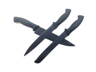 Composition of black knives isolated on white background. Composition of the chef knife, bread knife, carving knife, utility knife. Professional Set. Sharp blade. 