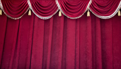 Heavy, dense burgundy theater curtain in the theater, philharmonic