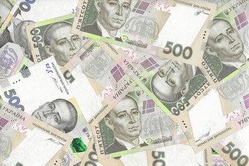 Ukrainian national currency is Hryvnia (UAH). A lot banknotes of 500 hryvnia lie chaotically. Financial background. Top view.