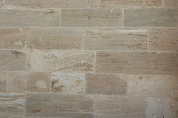 Texture of the wall made of natural stone blocks.