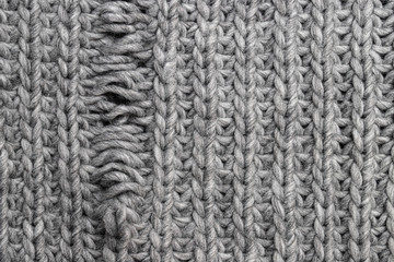 Light grey knitting texture with manufacturing defect isolated on white