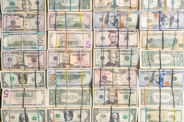 Background with America's money dollar bills close up tied with elastic bands