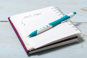 Open notebook with pencil