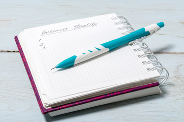 Open notebook with pencil