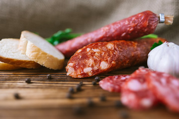 Italian salami with herbs, garlic and baguette slices