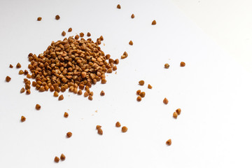 a pile of buckwheat isolated on white background