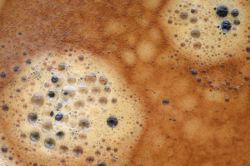 Black coffee with а cream foam texture.