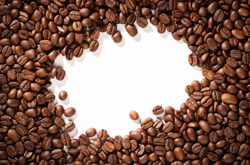 Coffee beans on a white background with place for text.