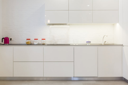 Modern white kitchen without handles