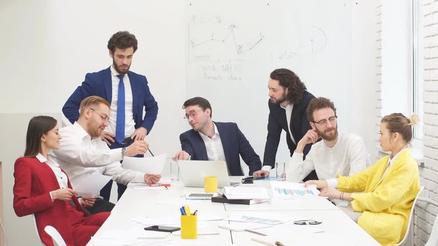 Best workers of successful busness team gathered in office to discuss new business project, to plan their strategy fot future together