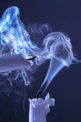 thick abstract smoke from two extinguished candles