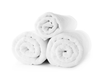 Fototapeta na wymiar Rolled fresh clean towels on white background