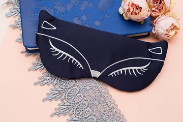 Selbstklebende Fototapeten Silk sleep mask with embroidery © Yana Mirta
