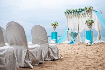 Outdoor wedding ceremony. Decoration of the arch with flowers on the beach