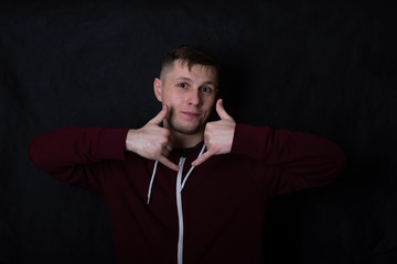 deaf and dumb young man shows a gesture to 