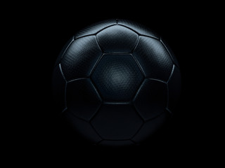 Black soccer ball against black background.