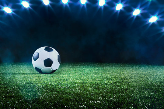 Football or soccer ball background with spotlights