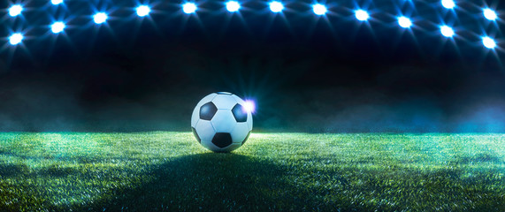 Football or soccer background with spotlights