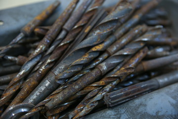 rusty drills in box close up