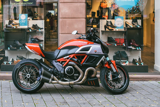 STRASBOURG, FRANCE - OCT 28, 2017: new Ducati Diavel motorcycle parked on a french street near showcase window. Ducati Diavel is the second cruiser motorcycle from Ducati