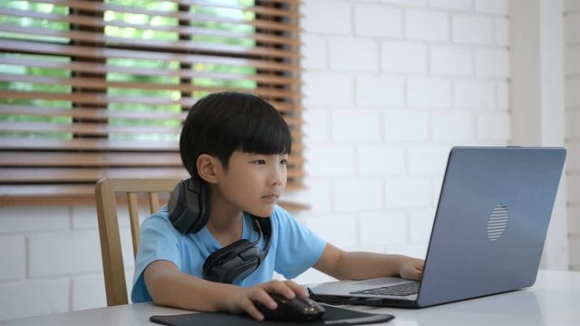 Family concept. Mother takes care of the son who is playing the game in the living room. 4k Resolution.