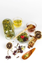 Medicinal herbal tea with honey on white background. Traditional treatment of flu and cold. Alternative medicine. Medicinal herbs.