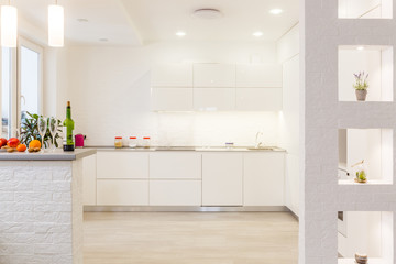 Modern white kitchen without handles