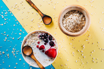 Breakfast. Bowl of oat milk with oat flakes and berries. Vegan food. Health day