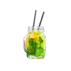 Homemade lemonade in a glass mug isolated on a white background. Refreshing  cold drink made from mint leaves, lime slices and lemon, juice, ice cubes. Mojito